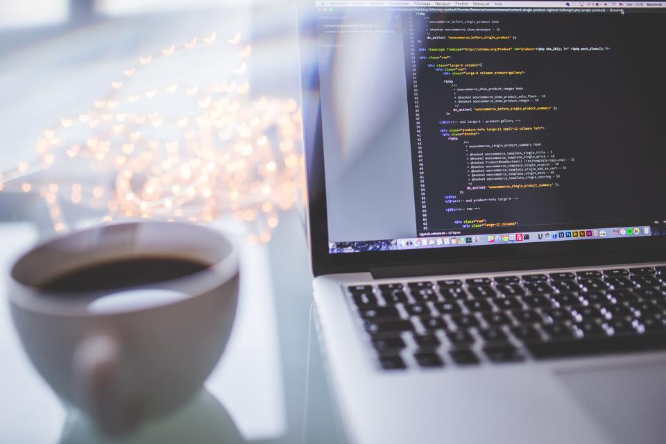 Coffee next to laptop